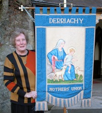 Pictured holding the branch banner is Mrs Sadie Black, a foundation member of Derriaghy Parish Mothers’ Union Branch.